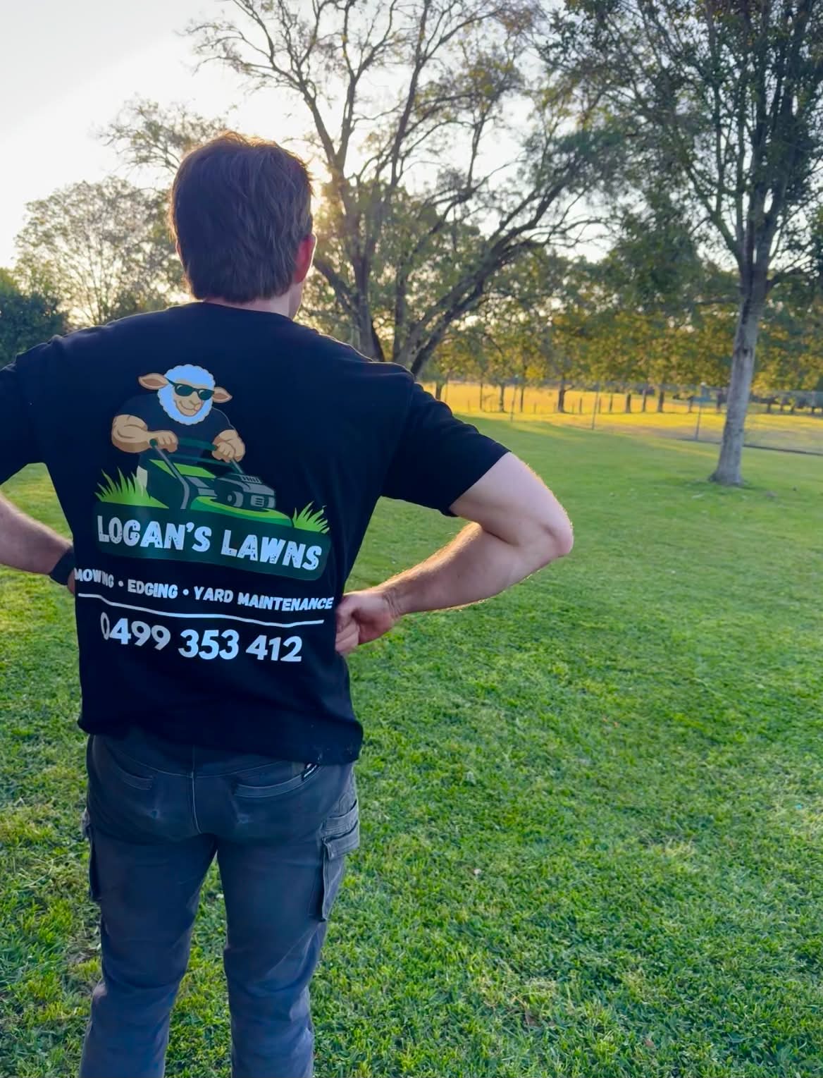 Logan from Logan's Lawns on a freshly mowed lawn in the Manning Valley